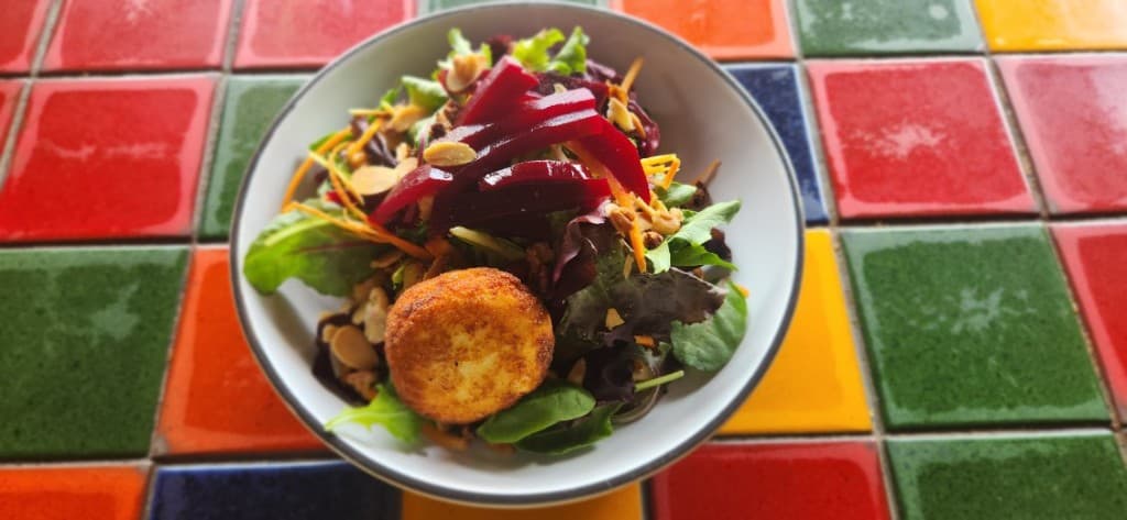 Fried goat cheese salad with beets and mixed toasted nuts at Bacchus, Italian restaurant in Richmond VA