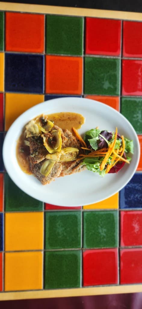 Veal scallopine with brown butter, lemon, capers, and artichoke at Bacchus, Italian restaurant in Richmond VA